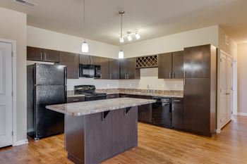 Large Kitchen With Island & Espresso Cabinets